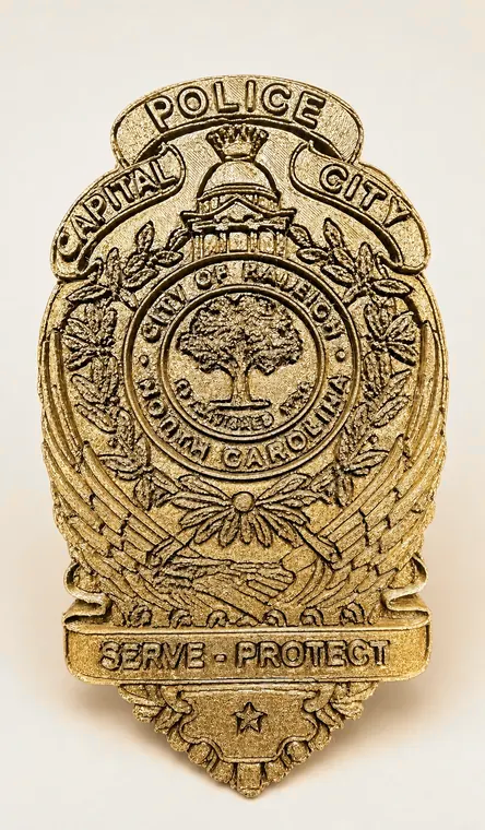 Gold North Carolina police badge plaque