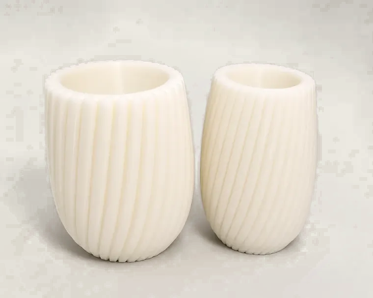 Pair of white spiral vases photographed in the studio