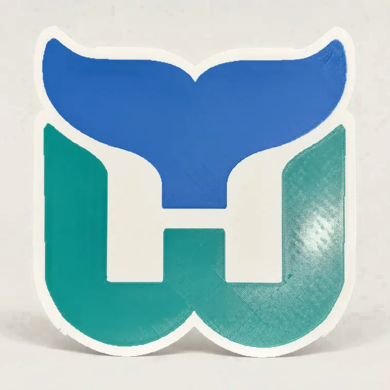 Blue, teal, and white layered team logo sign