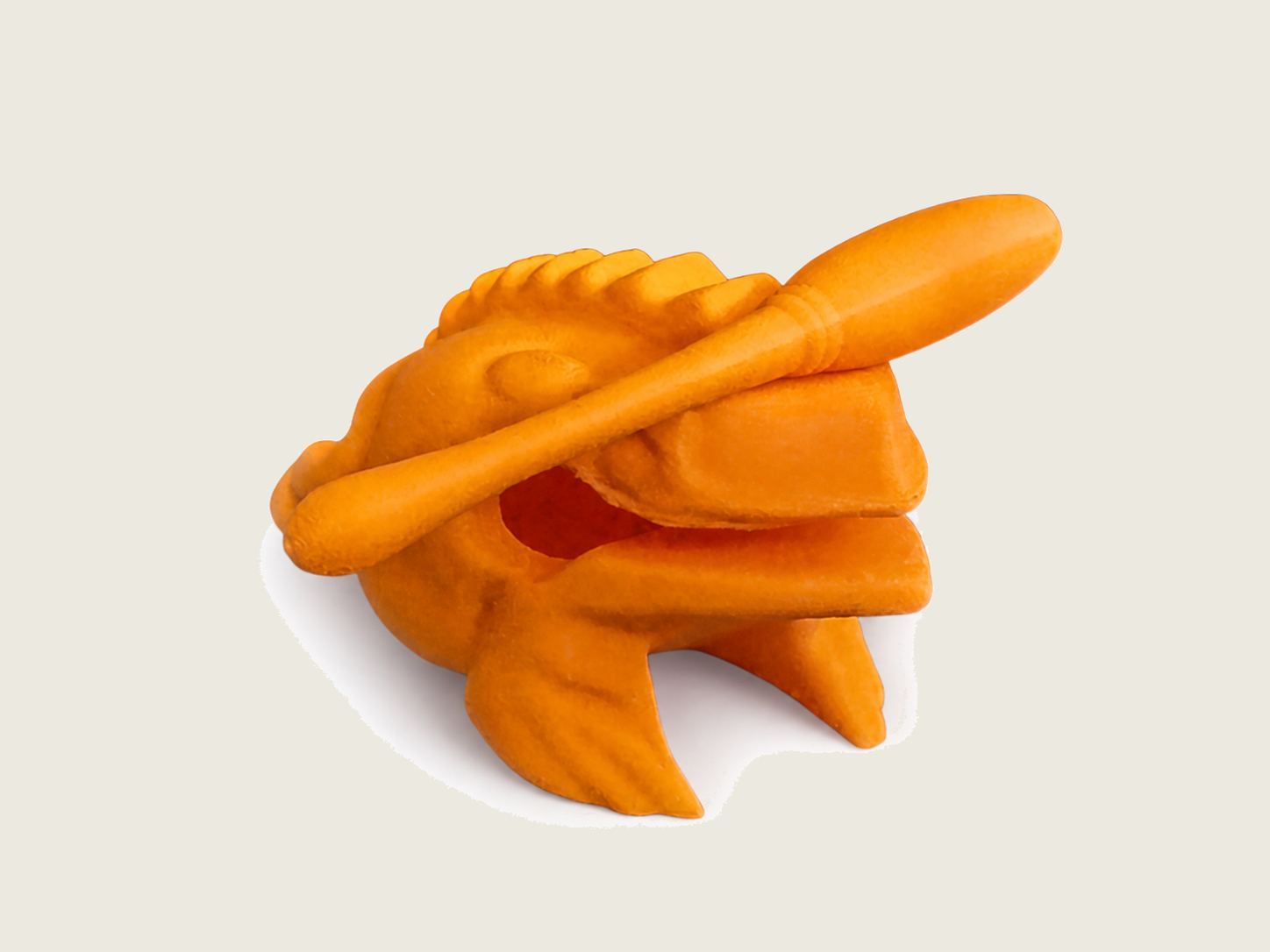 Orange percussion frog with mallet